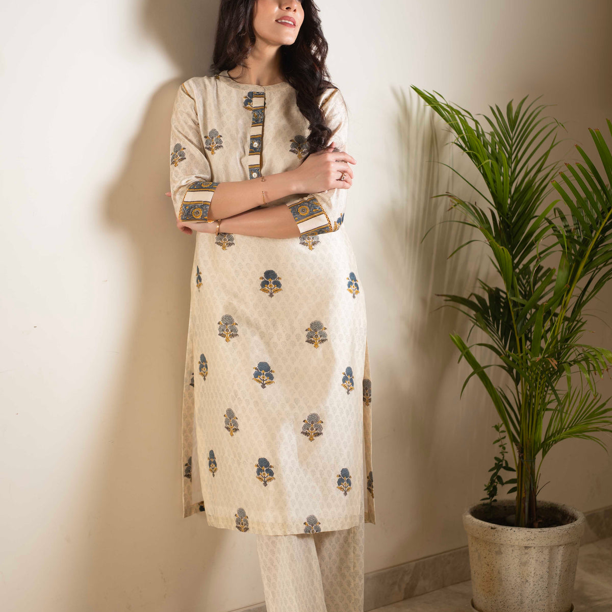 Beige cotton chanderi hand block printed A-line short kurta set with all-over multi colored flower.